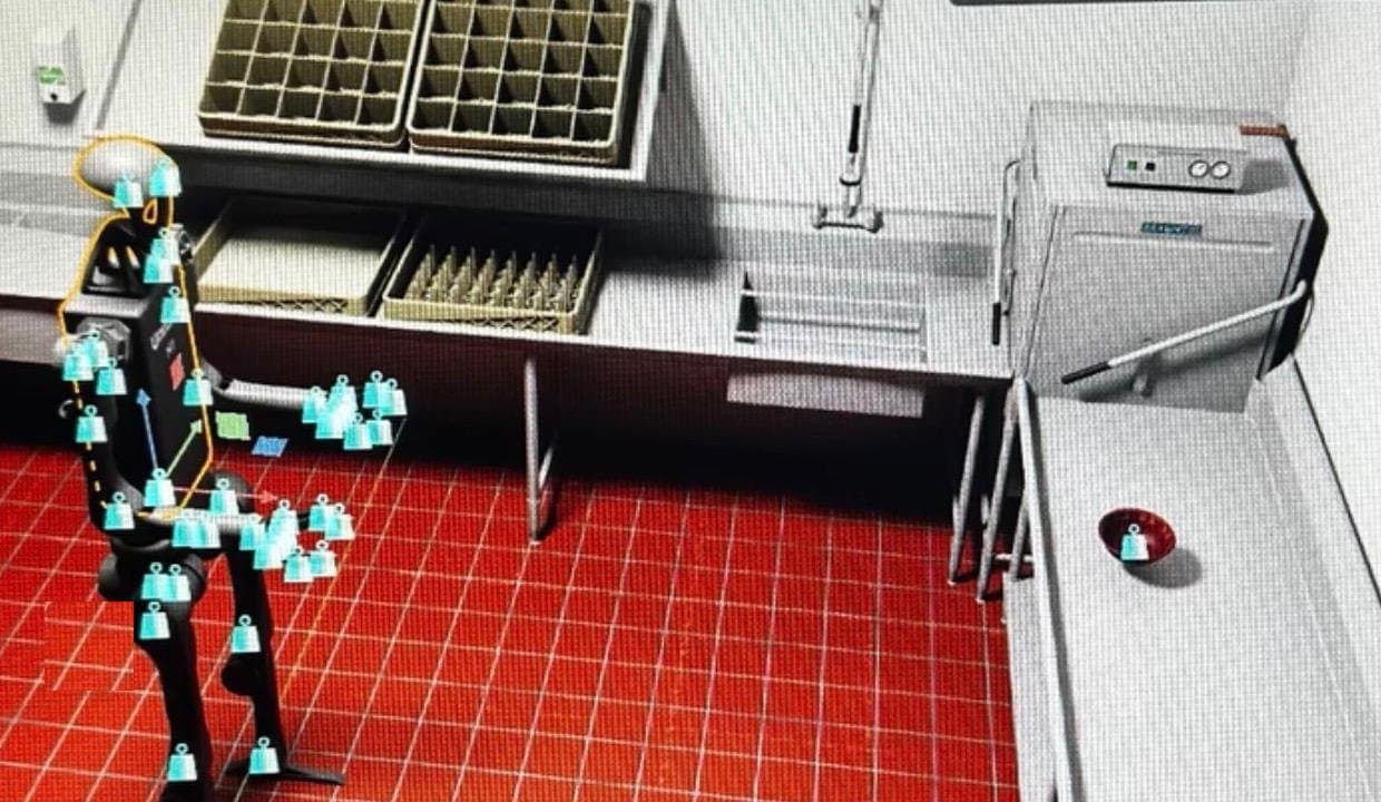 A simulation viewport: a humanoid robot with joint markers rehearsing tasks in a virtual commercial kitchen